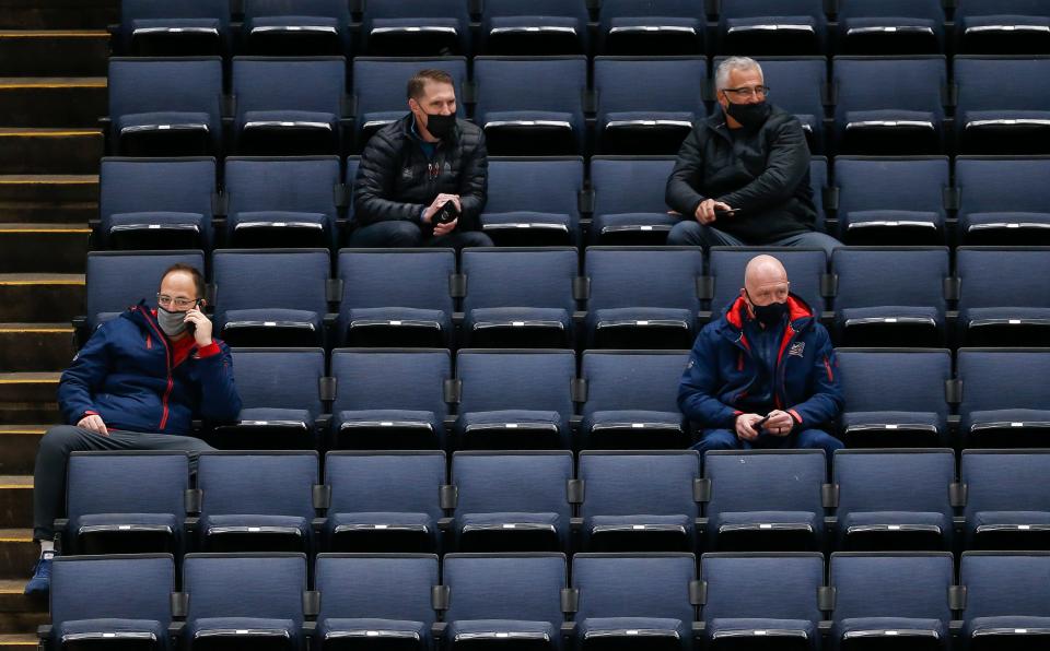 Clockwise from top left, Columbus Blue Jackets director of player personnel and Cleveland Monsters general manager Chris Clark, assistant general manager Basil McRae, general manager Jarmo Kekalainen and assistant meneral manager Josh Flynn watch training camp at Nationwide Arena in Columbus on Tuesday, Jan. 5, 2021. 