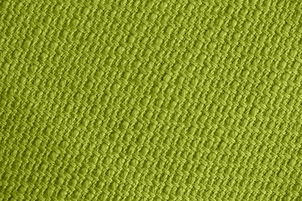 Close-up texture of green woven fabric
