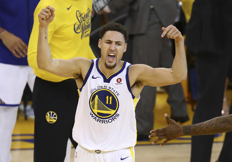 Klay Thompson celebrates during the second half of Game 6 of the Western Conference finals against the Rockets. (AP)