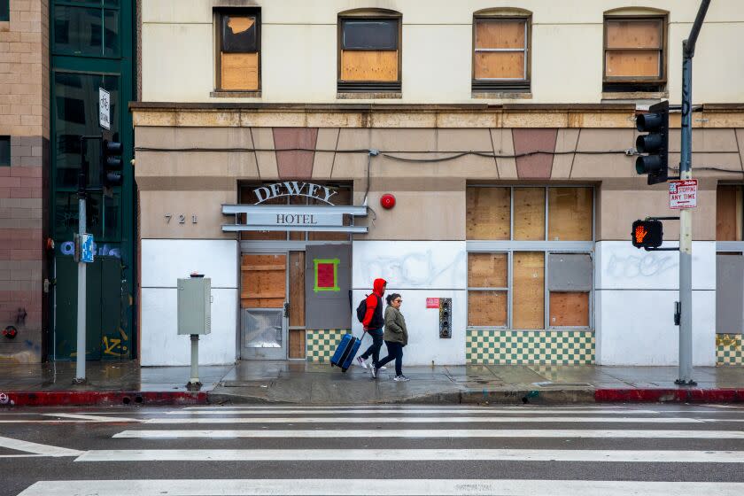 LOS ANGELES, CA - MARCH 10: Due to a recent fire boarded up and closed Skid Row Housing Trust property Dewey Hotel on Friday, March 10, 2023 in Los Angeles, CA. (Irfan Khan / Los Angeles Times)