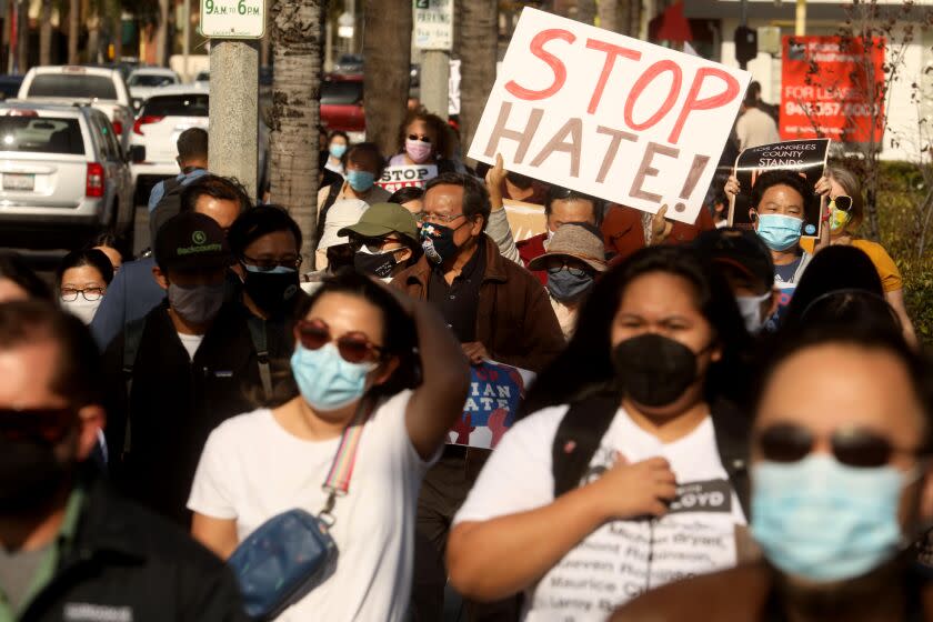 SAN GABRIEL, CA - MARCH 26, 2021 - - Around 200 residents, students and Alhambra and San Gabriel city leaders participate in a march to denounce anti-Asian sentiment, racism and hate crimes that have been exacerbated by the COVID-19 pandemic in San Gabriel on March 26, 2021. The march started at San Gabriel City Hall and proceeded to Alhambra City Hall. (Genaro Molina / Los Angeles Times)