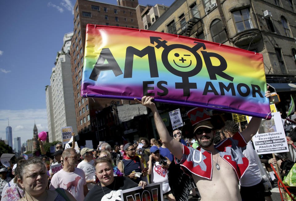 FILE - In this June 30, 2019, file photo, marchers participate in the Queer Liberation March in New York. This year's Pride events were supposed to be a blowout as LGBTQ people the world over marked the 50th anniversary of the first parade to celebrate what were then the initial small steps in their ability to live openly, and to advocate for bigger victories. Now, Pride is largely taking a backseat, having been driven to the internet by the coronavirus pandemic and now by calls for racial equality that were renewed by the killing of George Floyd in Minneapolis at the hands of police. (AP Photo/Seth Wenig, File)