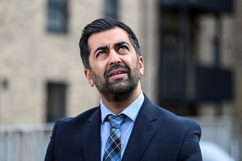 Scotland's First Minister Humza Yousaf visits a housing development in Dundee