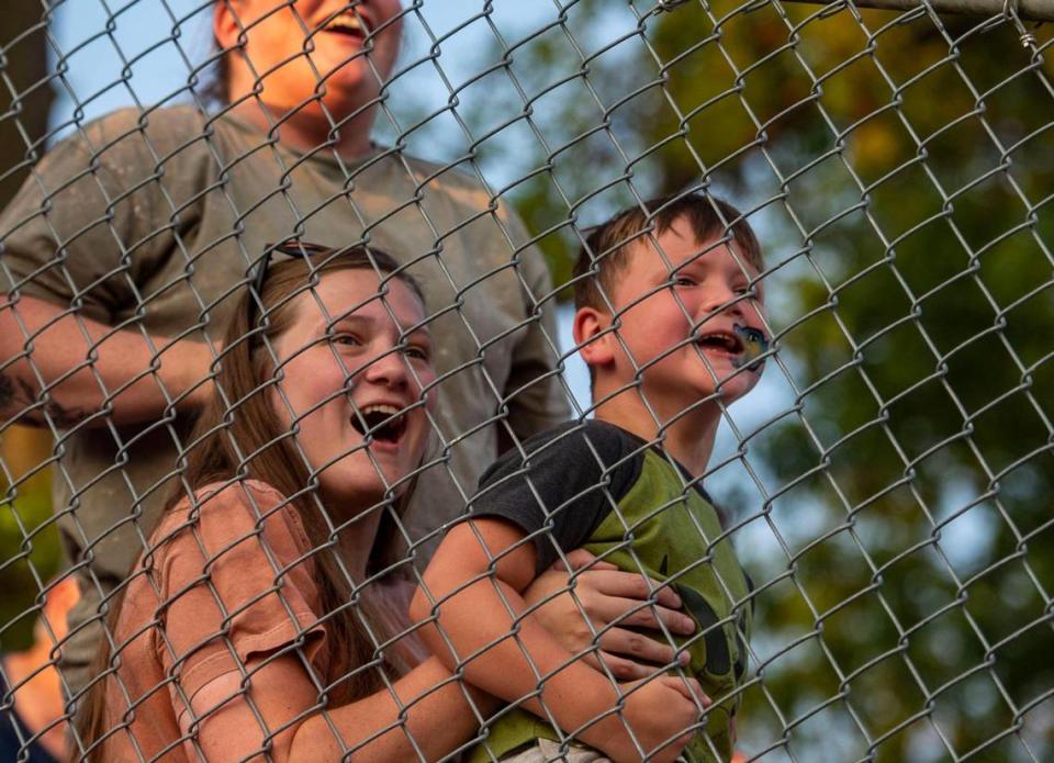 Fans cheer while watching the demolition derby at the Platte County Fair, Thursday, July 22, 2021, in Tracy, Missouri.