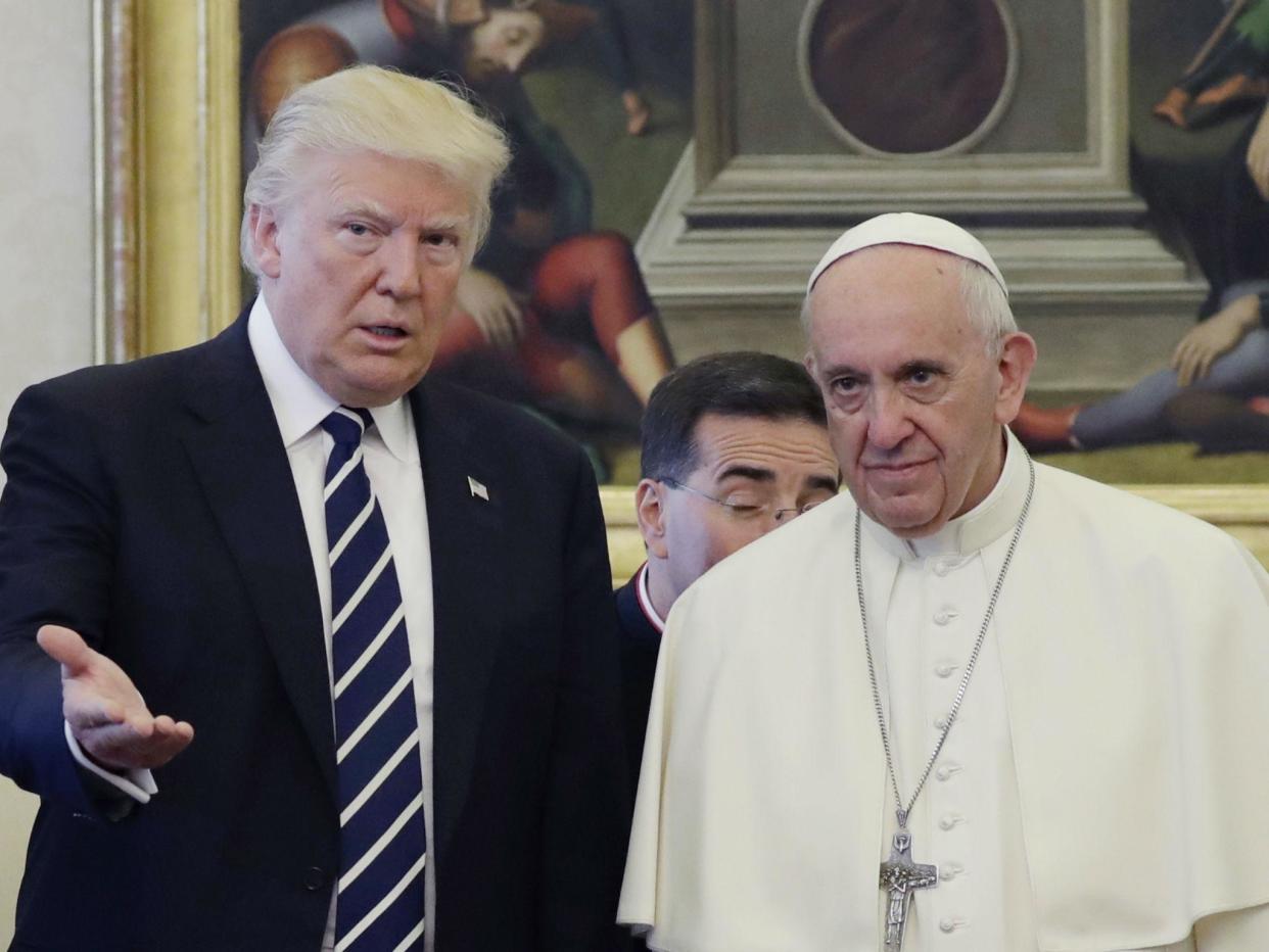 Pope Francis gave Donald Trump a letter he wrote regarding climate change as a gift on the president's visit to the Vatican: EVAN VUCCI/AFP/Getty Images