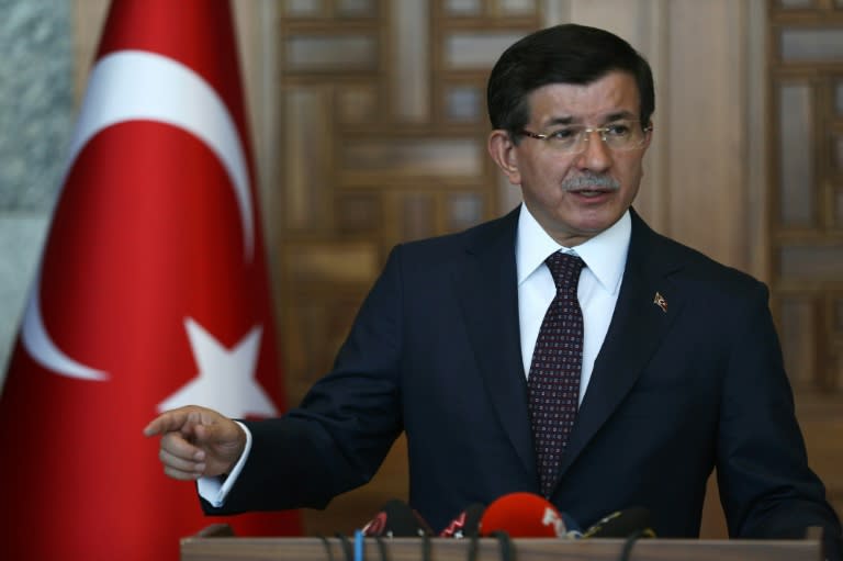 Turkey's Prime Minister Ahmet Davutoglu gives a statement on the situation with the Islamic State and other militant groups during a press conference in Ankara on July 24, 2015