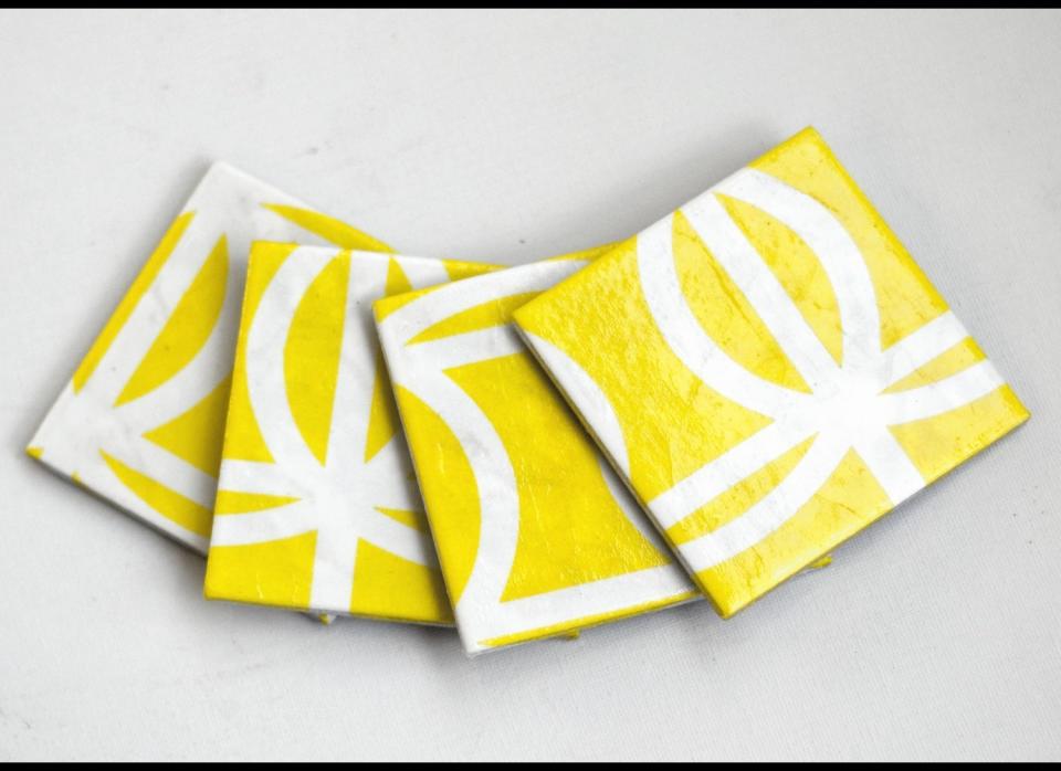 Rest your drink on one of these <a href="http://www.etsy.com/listing/96222961/ceramic-coasters-yellow-geometry-set-of?ref=sr_gallery_30&ga_includes%5B%5D=tags&ga_search_query=yellow+coasters&ga_search_type=all&ga_view_type=gallery" target="_hplink">ceramic coasters</a>. The glossy yellow will look extra bright and sunny outside on the patio table.   