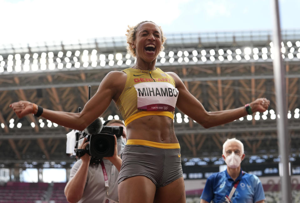 Malaika Mihambo, of Germany celebrates after winning the gold medal in the women's long jump final at the 2020 Summer Olympics, Tuesday, Aug. 3, 2021, in Tokyo, Japan. (AP Photo/Martin Meissner)