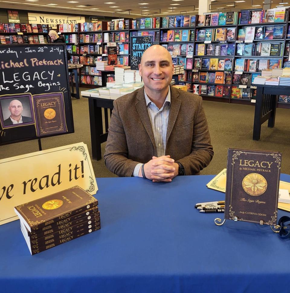 New Mexico State University alumus Michael Pietrack attends a book signing in Grand Junction, Colorado for his epic fable, "Legacy: The Saga Begins," published January 2023.