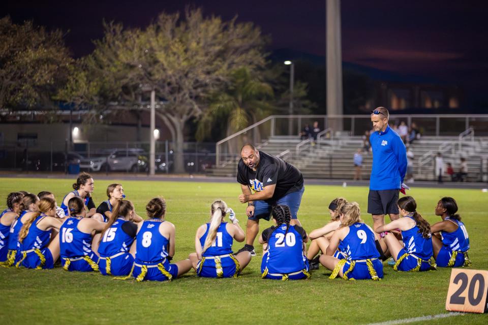 Head Coach Jeff Padgett, of Martin County, addresses his team at halftime in a high school flag football game at home against Fort Pierce Central, Thursday, Feb. 29, 2024.