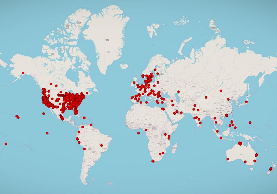 A world map showing hundreds of Android devices compromised by Spytech's spyware plotted on a world map, with large clusters in the U.S. and across Europe, and scattered dots throughout the rest of the world.