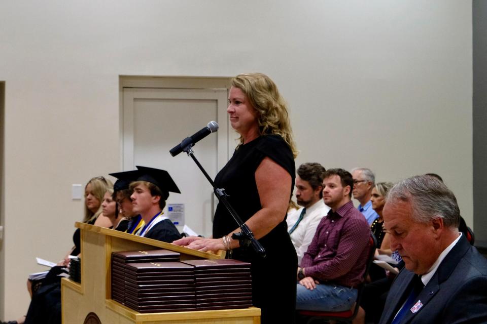 Madison Early College High principal Jennifer Caldwell looks on during the school's 2022 class graduation ceremony May 20.