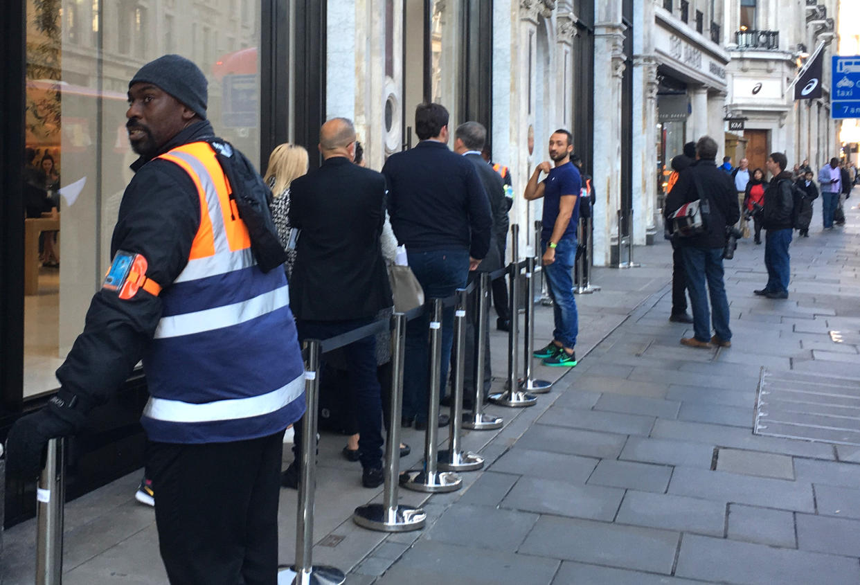 Barriers up, but few people queue for new iPhone (SWNS)