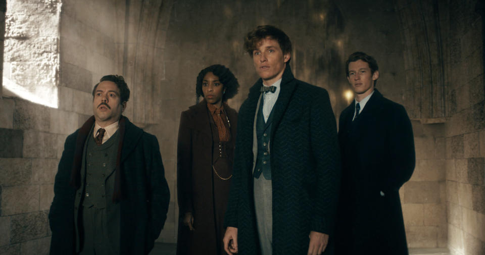 This image released by Warner Bros. Pictures shows, from left, Dan Fogler, Jessica Williams, Eddie Redmayne and Callum Turner in a scene from "Fantastic Beasts: The Secrets of Dumbledore." (Warner Bros. Pictures via AP)