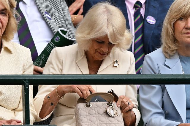 <p>ANDREJ ISAKOVIC/AFP via Getty</p> Queen Camilla at Wimbledon on July 10, 2024.