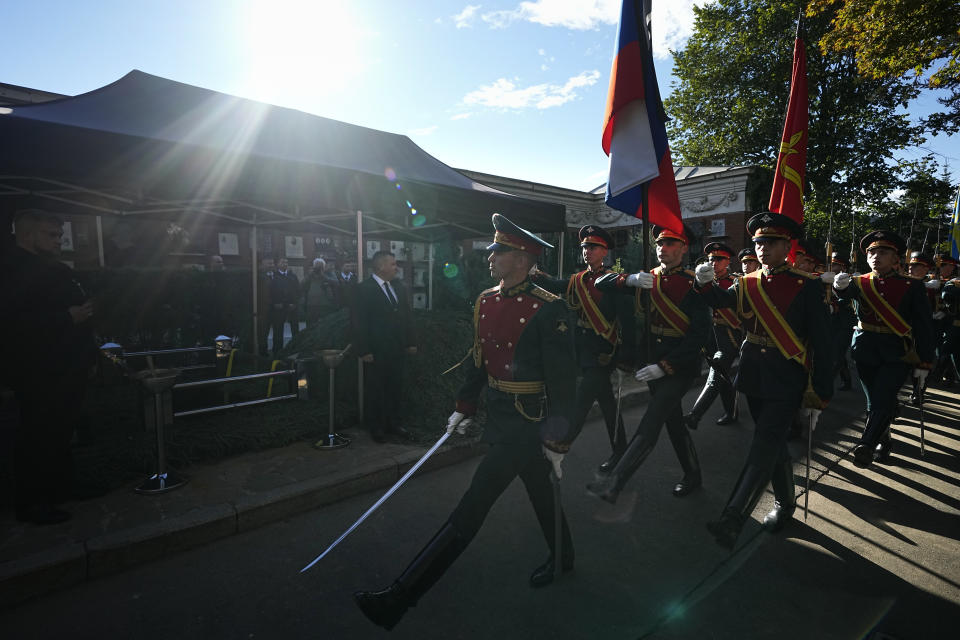 Honor guards march past the grave of Soviet President Mikhail Gorbachev during his funeral at Novodevichy Cemetery in Moscow, Russia, Saturday, Sept. 3, 2022. (AP Photo/Alexander Zemlianichenko, Pool)