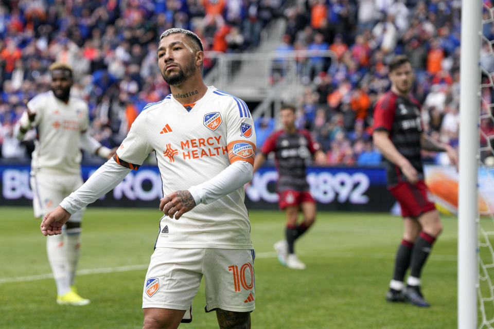 FC Cincinnati's Luciano Acosta (10) reacts after a missed shot on goal during the second half of a MLS soccer match against Toronto FC Sunday, Feb. 25, 2024, in Cincinnati. (AP Photo/Jeff Dean)