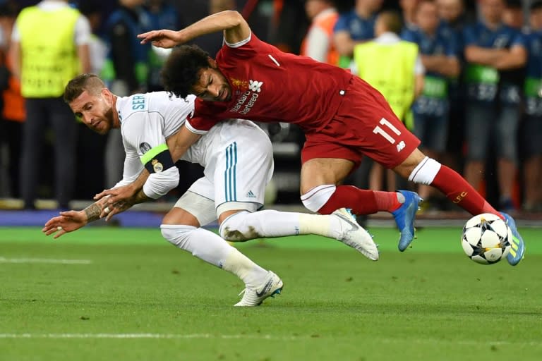 Mohamed Salah injured his shoulder in this challenge by Real Madrid's Sergio Ramos