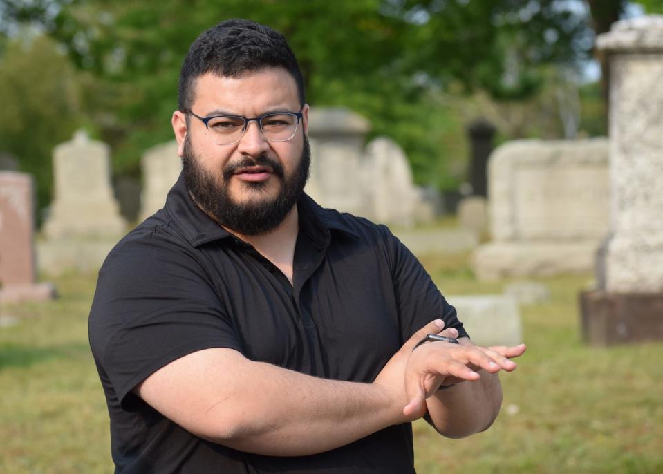 Fall River's assistant planner Chris Parayno speaks during a tour of Oak Grove Cemetery on Wednesday, May 24, outlining potential updates to the cemetery as part of a master plan.