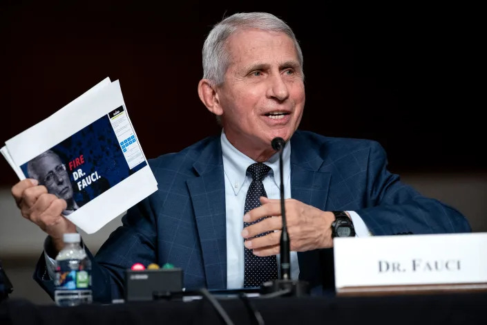 Dr. Anthony Fauci, White House Chief Medical Advisor and Director of the NIAID, shows a screen grab of a campaign website while answering questions from Sen. Rand Paul (R-Ky.) during a Senate Health, Education, Labor, and Pensions Committee hearing to examine the federal response to COVID-19 and new emerging variants on Capitol Hill in Washington, DC on January 11, 2022. (Photo by Greg Nash / POOL / AFP) (Photo by GREG NASH/POOL/AFP via Getty Images)