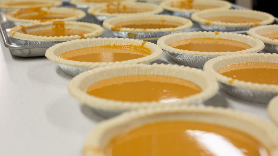 Pumpkin pies are lined up before being baked at Robert F. Wagner Middle School in New York. - Laura Oliverio/CNN