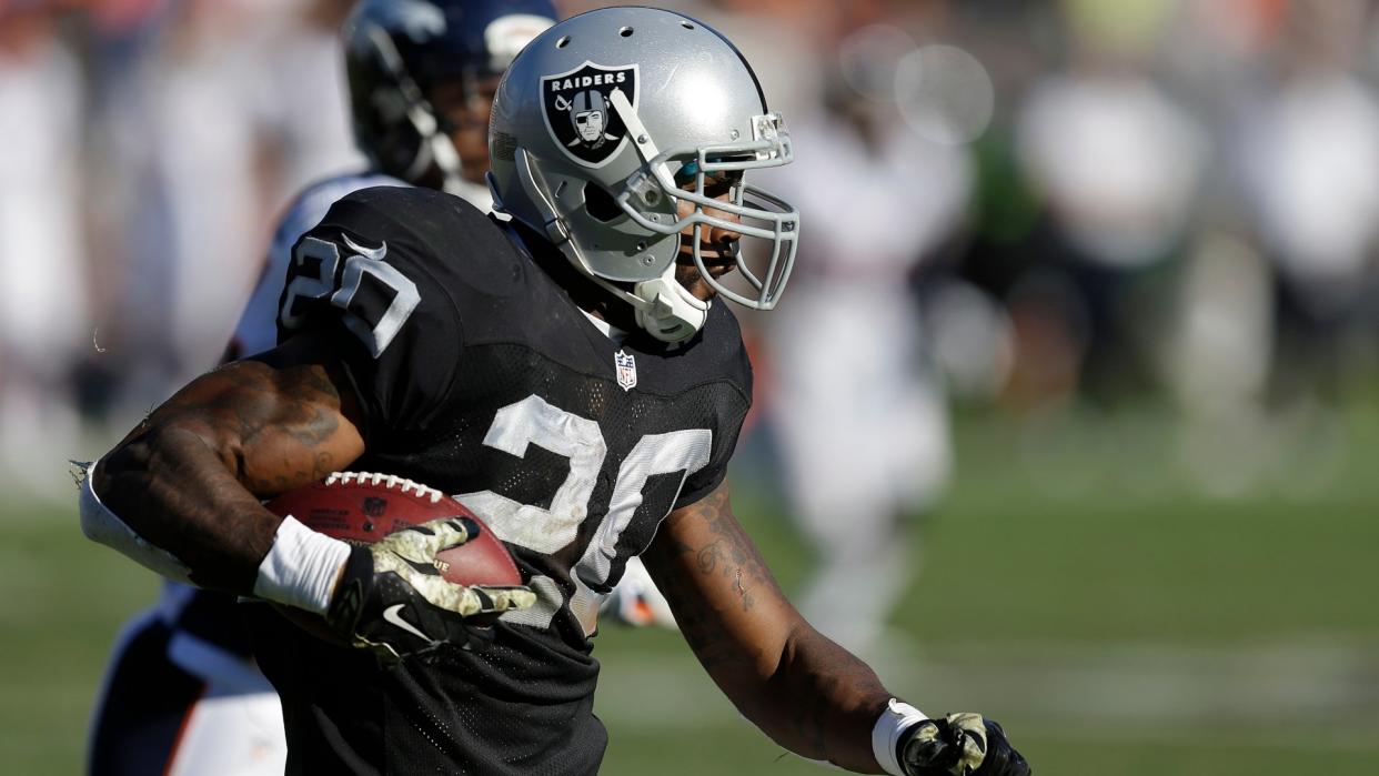 Mandatory Credit: Photo by Ben Margot/AP/Shutterstock (6017003ba)Darren McFadden Oakland Raiders running back Darren McFadden (20) runs against the Denver Broncos during the second quarter of an NFL football game in Oakland, CalifBroncos Raiders Football, Oakland, USA.