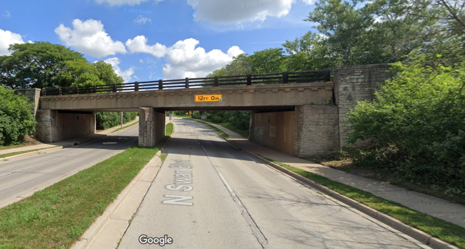 A view of the railroad bridge over Swan Boulevard in Wauwatosa, looking north. The bridge clearance in the northbound lanes is 12 feet, while the clearance in the southbound direction is just 11 feet 6 inches.