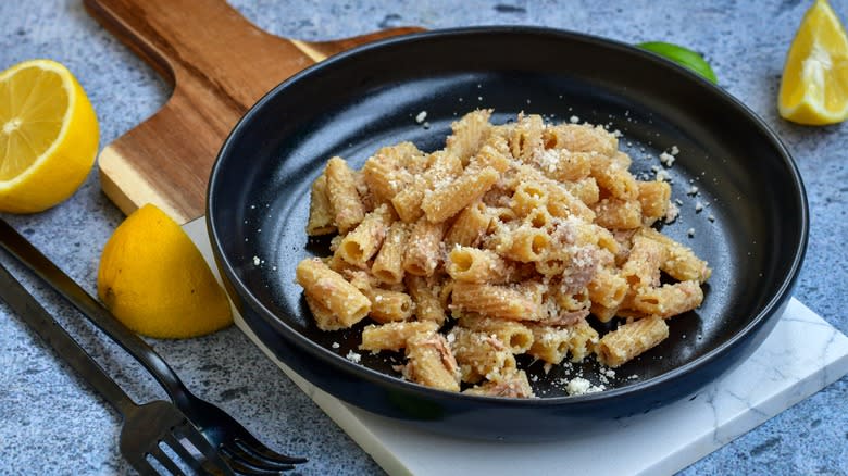 Cheesy chickpea rigatoni in black dish