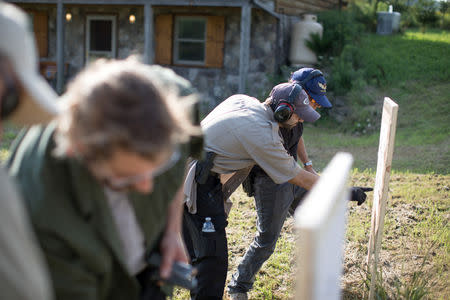 Trainees evaluate their scores at a shooting range as they take part in the Cherev Gidon Firearms Training Academy in Honesdale, Pennsylvania, U.S. August 5, 2018. REUTERS/Noam Moskowitz