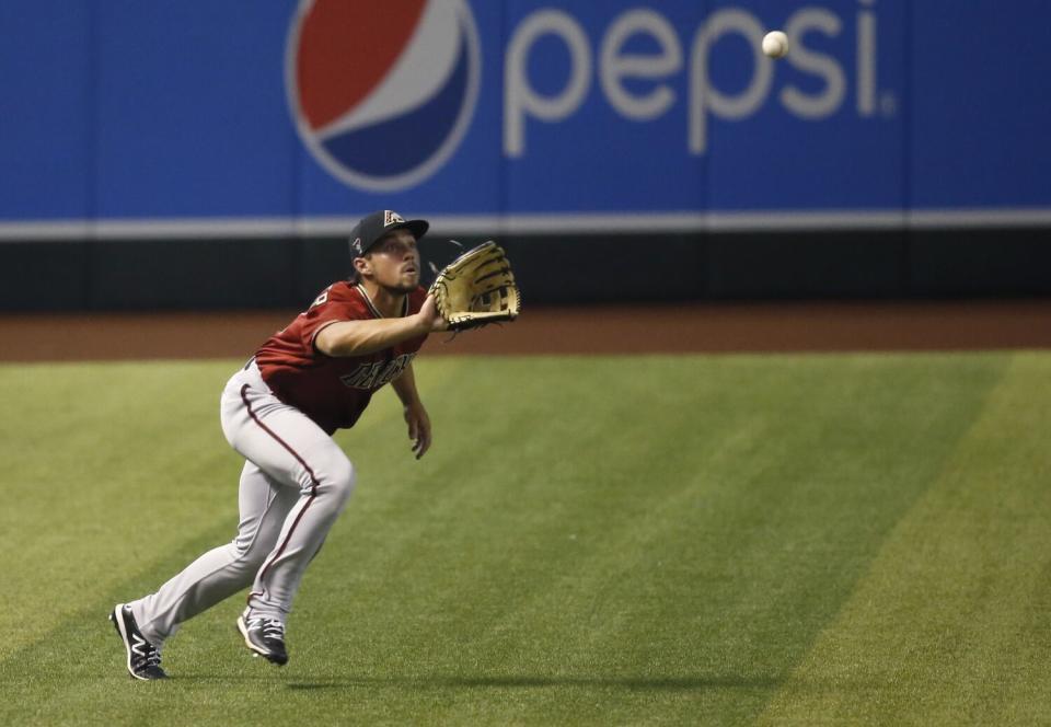 Arizona Diamondbacks left fielder Dominic Fletcher chases down a fly ball during an intrasquad game on July 6, 2020.