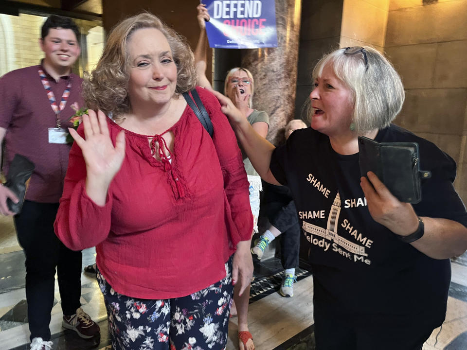 Sen. Carol Blood waves to a crowd of supporters in the Nebraska Capitol rotunda after the failure of a bill that would have banned abortion around the sixth week of pregnancy, Thursday, April 27, 2023 in Lincoln, Neb. Blood was one of a minority of lawmakers opposed to the bill who managed to garner enough support to successfully filibuster the bill, which is now likely dead for the year. That leaves in place a 2010 law that bans abortions at 20 weeks. (AP Photo/Margery Beck)