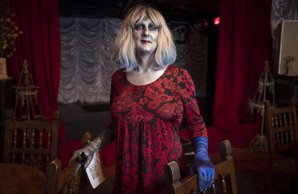 Emma Scott Lavin, who performs drag under the stage name We Are Belov3d, stands in Old Nick's Pub Sunday, Oct. 30, 2022, in Eugene, Ore. Lavin confronted protesters at the venue where a Drag Queen Storytime was happening a week earlier. (AP Photo/Andy Nelson)