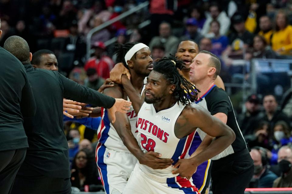 Detroit Pistons center Isaiah Stewart (28) is held back after a foul during the second half of an NBA basketball game against the Los Angeles Lakers, Sunday, Nov. 21, 2021, in Detroit.