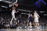 Gonzaga forward Anton Watson dunks in the first half of an Elite 8 college basketball game against UConn in the West Region final of the NCAA Tournament, Saturday, March 25, 2023, in Las Vegas. (AP Photo/John Locher)