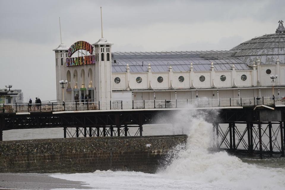 Smaller waves than Friday’s crash against the Brighton Palace Pier (Adam Davy/PA) (PA Wire)