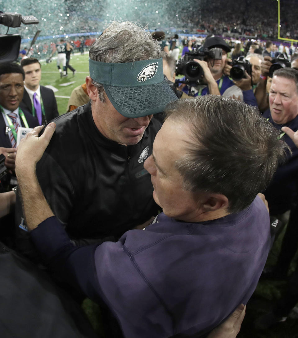 <p>Philadelphia Eagles head coach Doug Pederson, left, hugs New England Patriots head coach Bill Belichick after the NFL Super Bowl 52 football game Sunday, Feb. 4, 2018, in Minneapolis. The Eagles won 41-33. (AP Photo/Matt Slocum) </p>