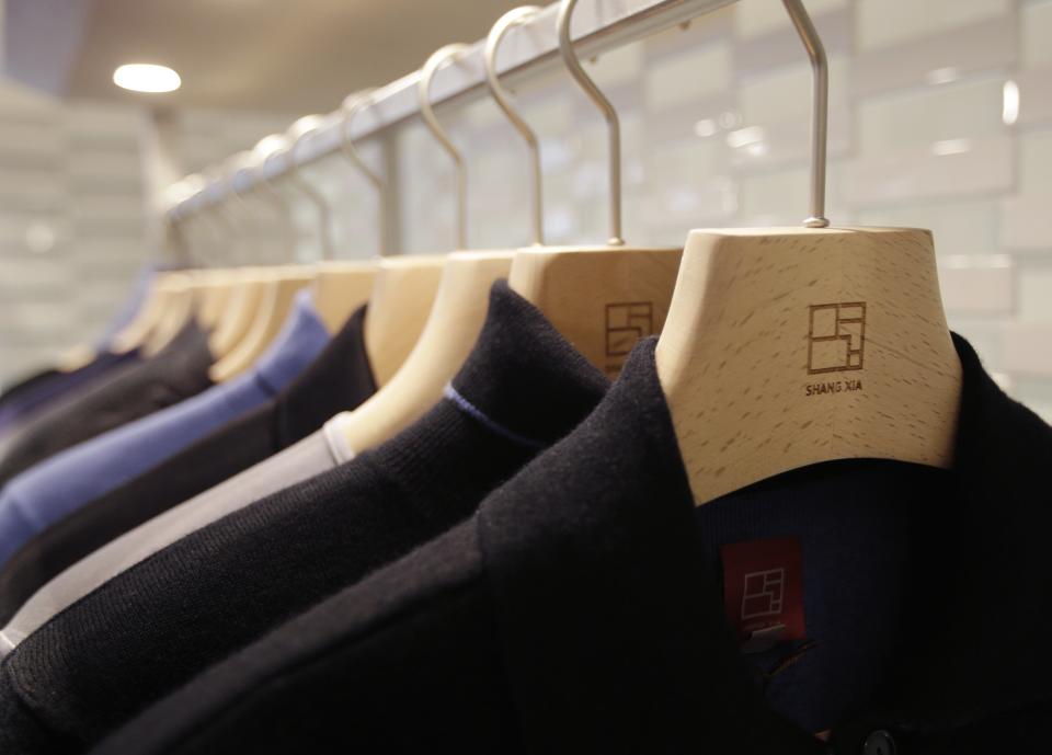 Cashmere jackets are displayed for sale in the shop of the young brand Shang Xia on its opening day in Paris