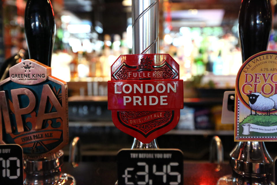 London Pride beer is seen for sale at a Wetherspoon pub in North London, Wednesday, June 13, 2018. A major U.K. pub chain will stop serving French Champagne and German wheat beers next month and offer more British drinks to prepare for the country's departure from the European Union. Tim Martin, the founder of the JD Wetherspoon chain and a strong advocate for Brexit, says the aim is to make the business more competitive for when Brexit becomes a reality. (AP Photo/Robert Stevens)