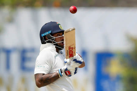 Cricket - Sri Lanka v India - First Test Match - Galle, Sri Lanka - July 26, 2017 - India's cricketer Shikhar Dhawan plays a shot. REUTERS/Dinuka Liyanawatte