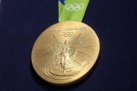 <p>A close-up of the gold medal designed for the Rio 2016 Olympics. (Alexandre Loureiro/Getty Images) </p>