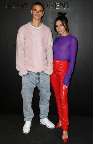 Dominique Charriau/WireImage Romeo Beckham and Victoria Beckham.