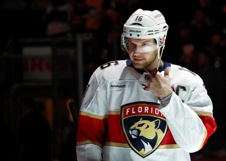 Jan 24, 2023; Pittsburgh, Pennsylvania, USA; Florida Panthers center Aleksander Barkov (16) straps his helmet on to play the Pittsburgh Penguins during the first period at PPG Paints Arena. Mandatory Credit: Charles LeClaire-USA TODAY Sports