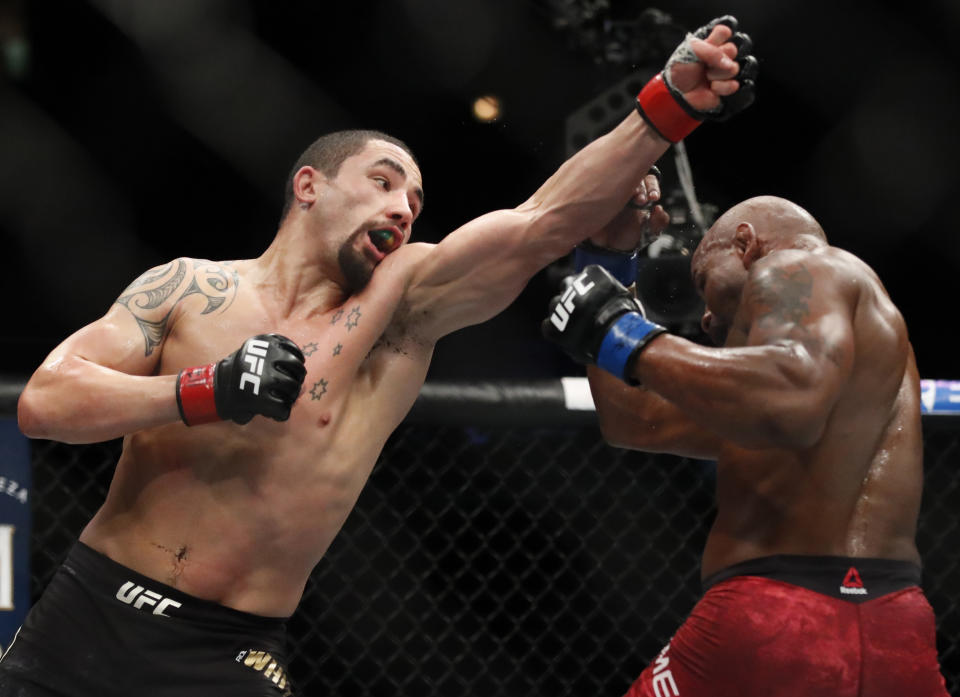 Robert Whittaker, left, and Yoel Romero fight during their Title bout at the UFC 225 Mixed Martial Arts event Sunday, June 10, 2018, in Chicago. (AP Photo/Jim Young)
