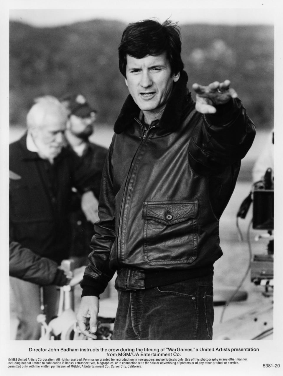 CIRCA 1983: John Badham directs behind the scenes for the MGM/UA movie  