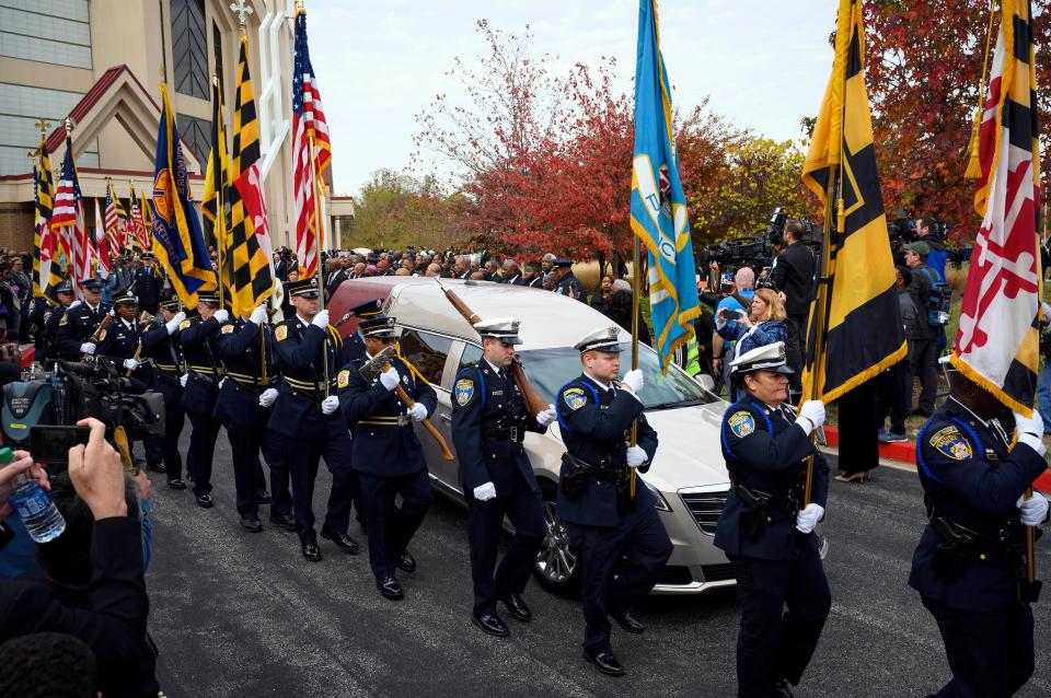 The honor guard proceeds past the hearse with the casket of Rep. Elijah Cummings following the funeral at the New Psalmist Baptist Church in Baltimore. 