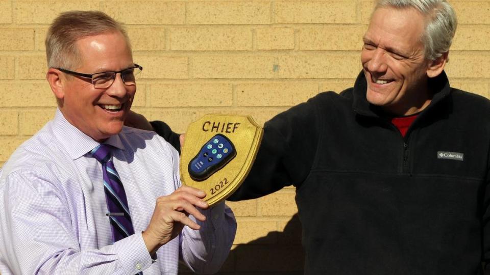 Eric Thomas, right, hands off the “clicker” Al Conklin, who will succeed Thomas as WBTV chief meteorologist after he retires this month. The pair have worked side-by-side for decades.