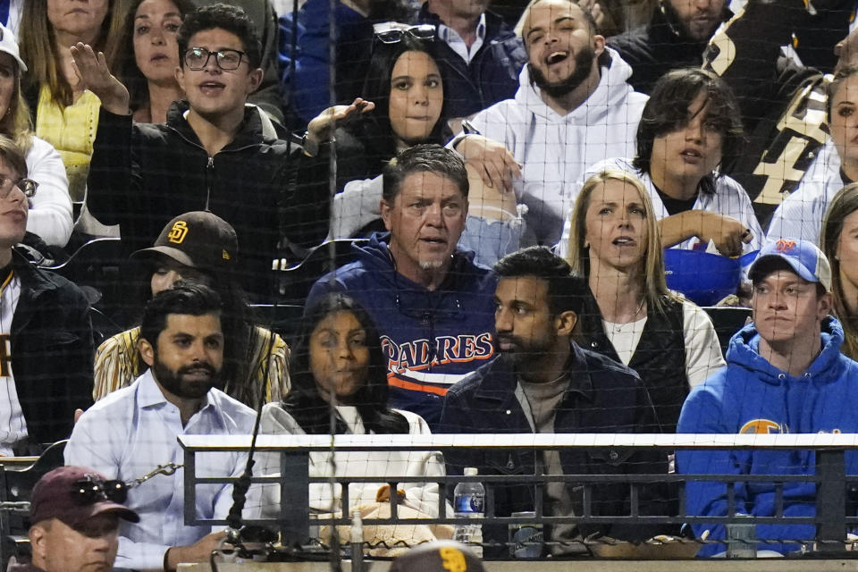 Former pitcher David Weathers, center, watches during the fifth inning of a baseball game between the New York Mets and the San Diego Padres on Tuesday, April 11, 2023, in New York. (AP Photo/Frank Franklin II)