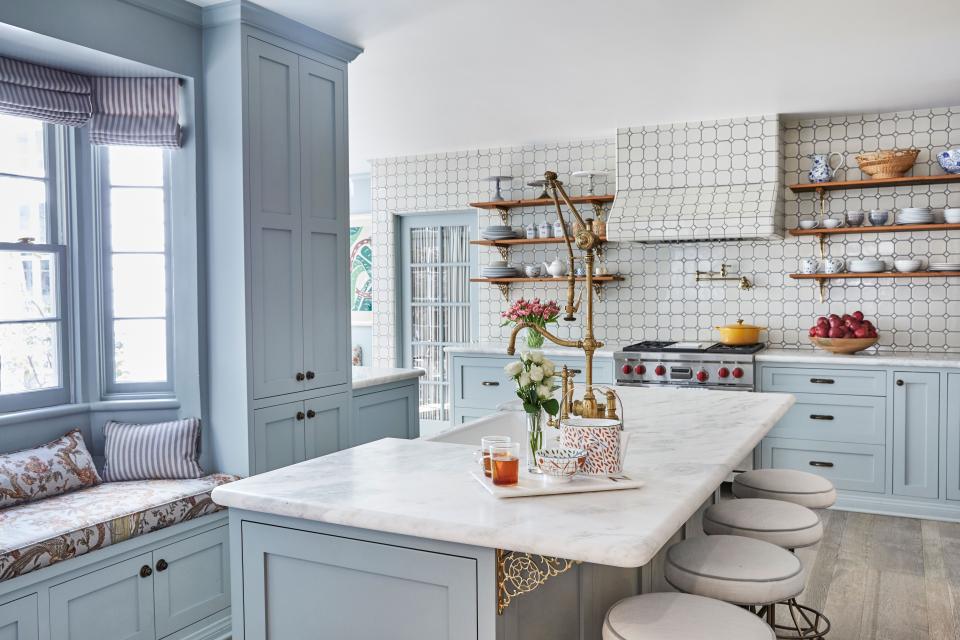 In the kitchen, Roxy chose Haze Blue by Dunn Edwards to coat the cabinetry and walls, complemented by Waterstone fixtures and open shelving holding some of Roxy’s collection of vintage tea sets. “The open shelves make it feel fun and younger. My mom always says, ‘It’s going to get dusty, Roxy!’ And I’m like, ‘No it’s not, Mom,’ but then she’s completely right.”