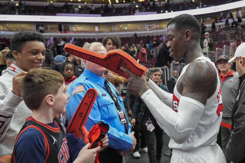 Toronto Raptors guard Dennis Schroder signs autographs for fans after an NBA basketball game against the Chicago Bulls, Tuesday, Jan. 30, 2024, in Chicago. Toronto won 118-107. (AP Photo/Erin Hooley)