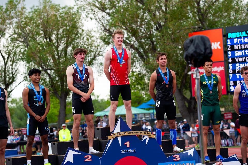 Liberty Common's Jack Friesen takes to the podium after coming in first place during the Colorado track & field state championships on Saturday, May 17, 2024 at Jeffco Stadium in Lakewood, Colo.